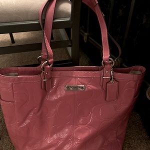 Coach handbag/tote is great for Spring/Summer outfits. This lovely patent pink.